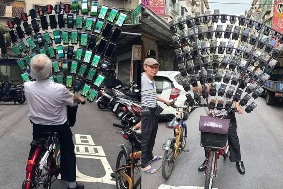 Idoso asiático usa bicicleta com 64 celulares para jogar Pokémon GO