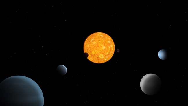 TOI-178, in the center, and the six planets that orbit it are shown in this illustration.