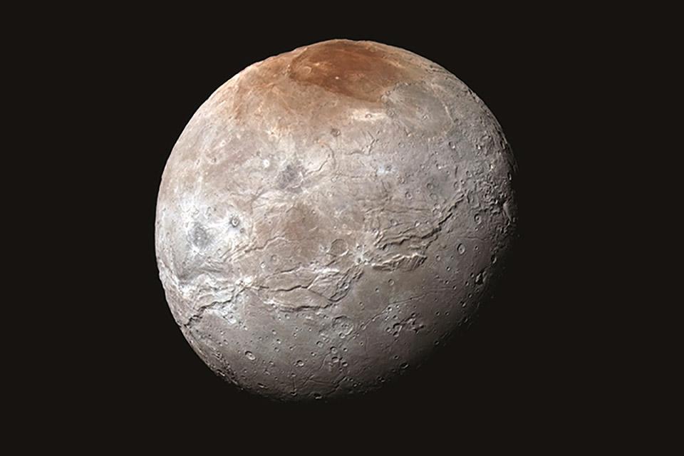 Cientistas explicam mancha vermelha da lua Caronte, de Plutão