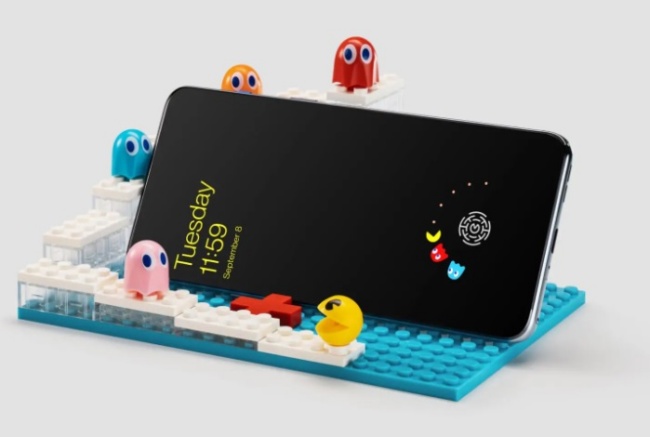 Mobile phone stylized with Pac-Man game.