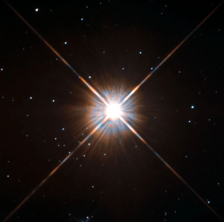 A imagem apresenta a estrela Proxima Centauri em uma captura realizada pelo Telescópio Espacial Hubble.